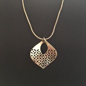 Very pretty gold shaped pendant with chain.